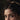 Close-up of the eyes and curly hair with a gold-coloured hairband. Impudent Appetite