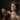 Close-up of a woman in a laurel wreath and white dress giving the thumbs down. Thumbs of Rome